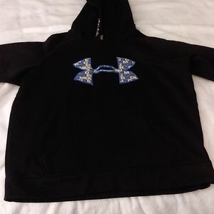 This is an Under Armor light jacket for a 7, 8, or 9-year-old boy for school.